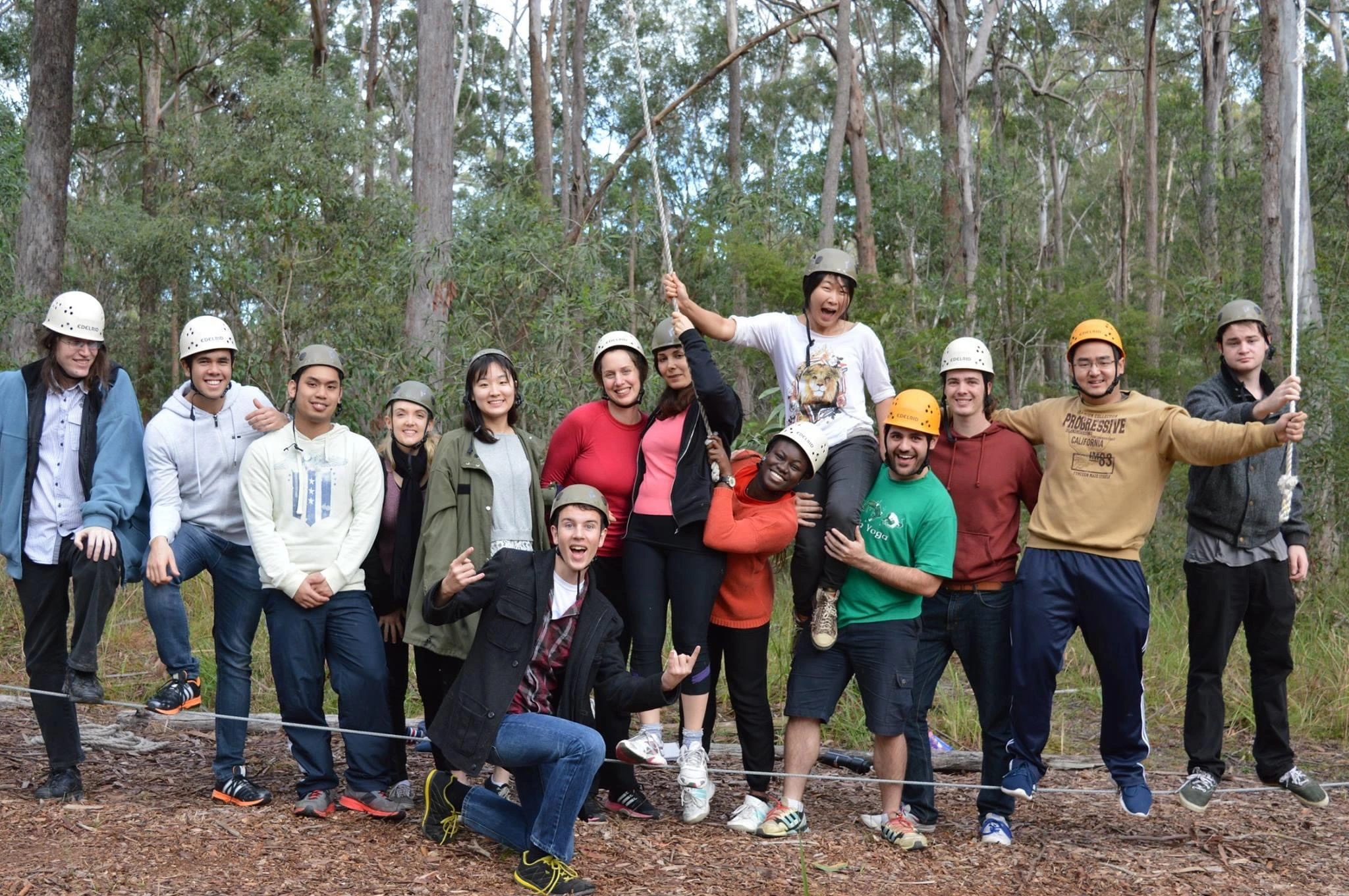 Students standing on a rope challenge